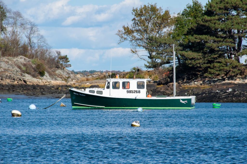 Green lobster fishing boat moored in Marblehead Harbor Massachusetts