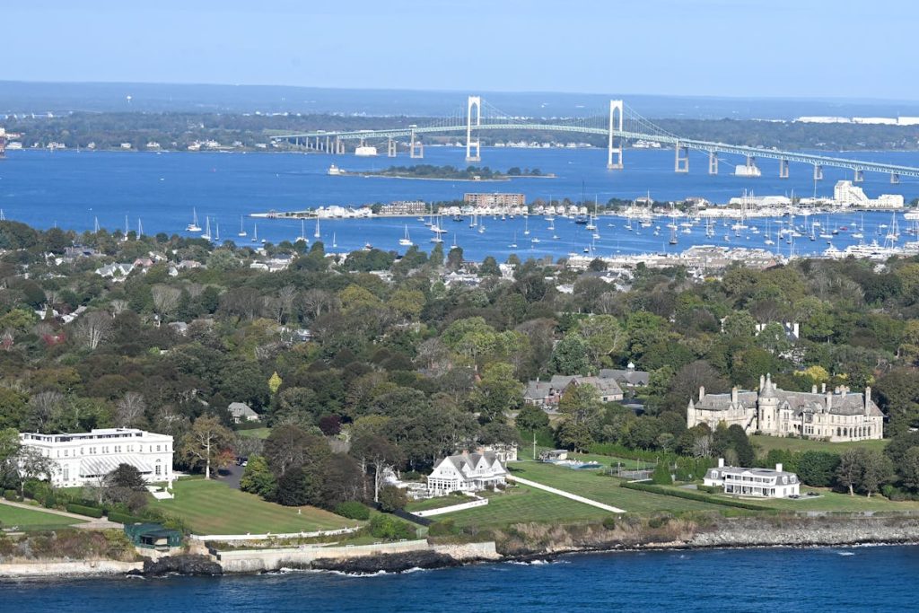 Aerial view of Newport Rhode Island coastline with Gilded Age mansions and Pell Bridge